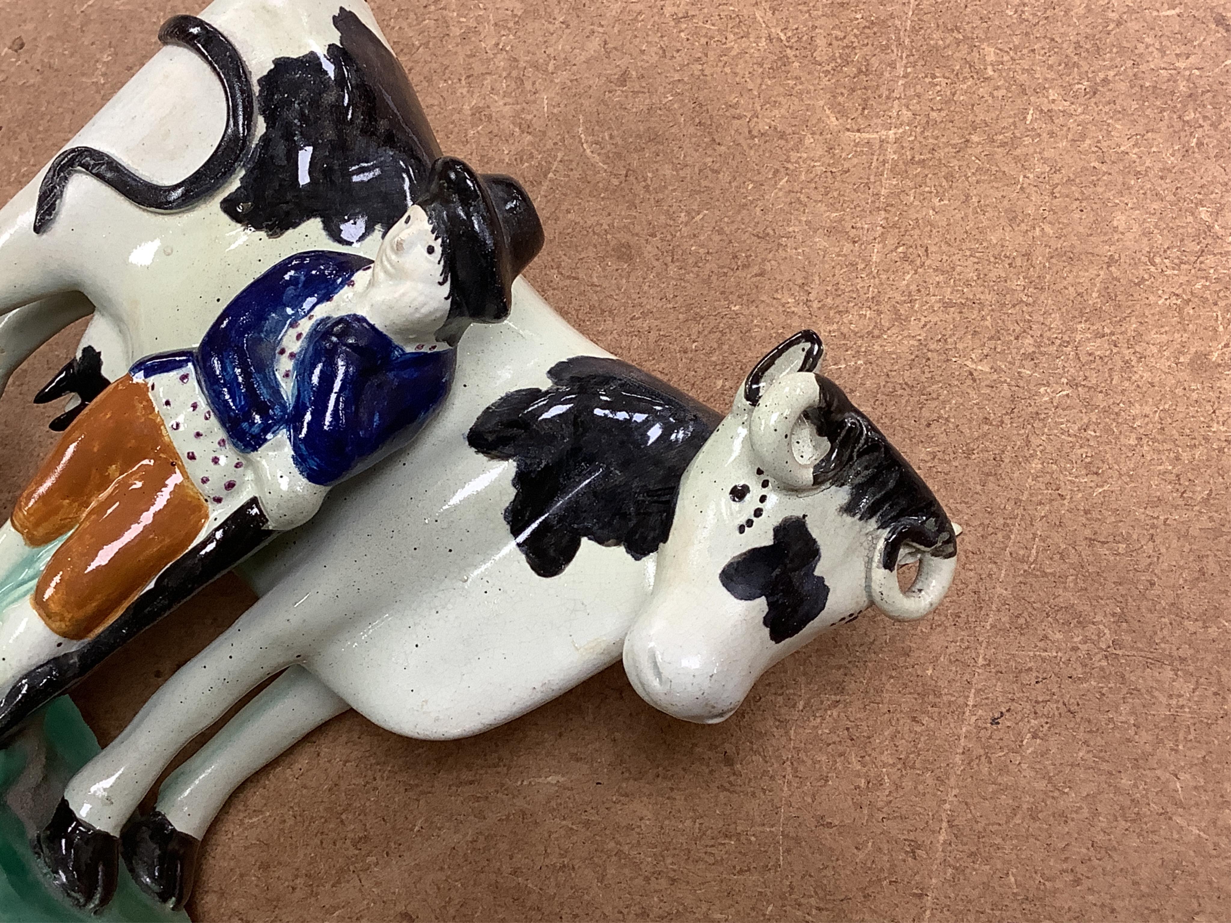 Two Yorkshire Prattware cows, with farmer or milkmaid and dog groups, c.1810